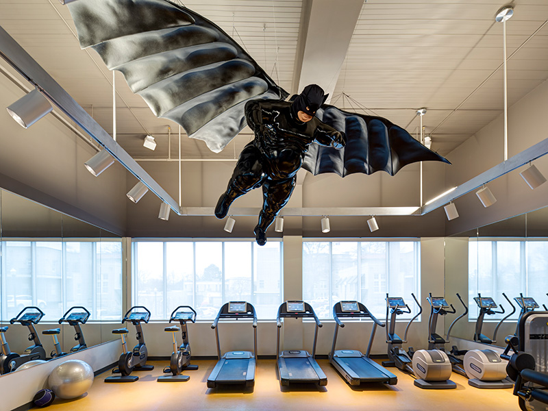 A standard gym... with a large fat batman sculpture on the ceiling