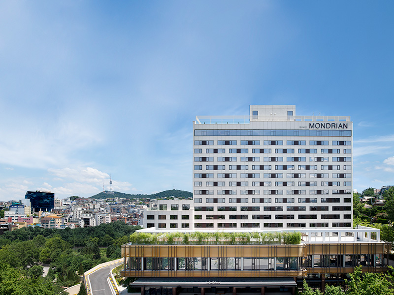 Exterior of the Mondrian Seoul, a white building which has about 14 floors
