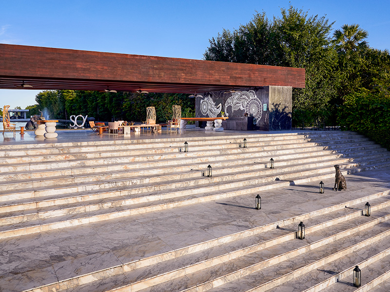 Very wide steps leading up to an outside seating area